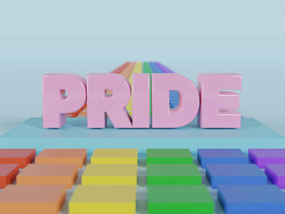 Das Wort Pride - Stolz - steht in großen rosafarbenen Buchstaben auf hellblauen Grund und  von Regenbogenfarben ergänzt als Zeichen für die LGBTQAI+ Community. (c) Foto: Pexels